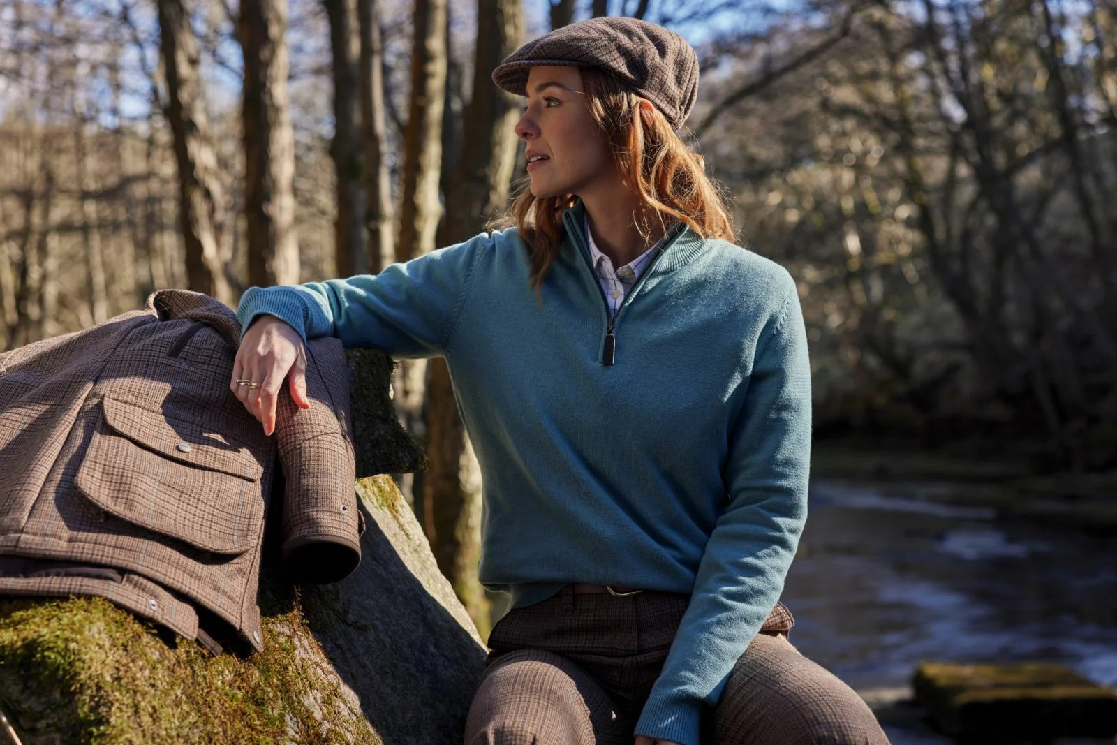 Male wearing country clothing sat outside